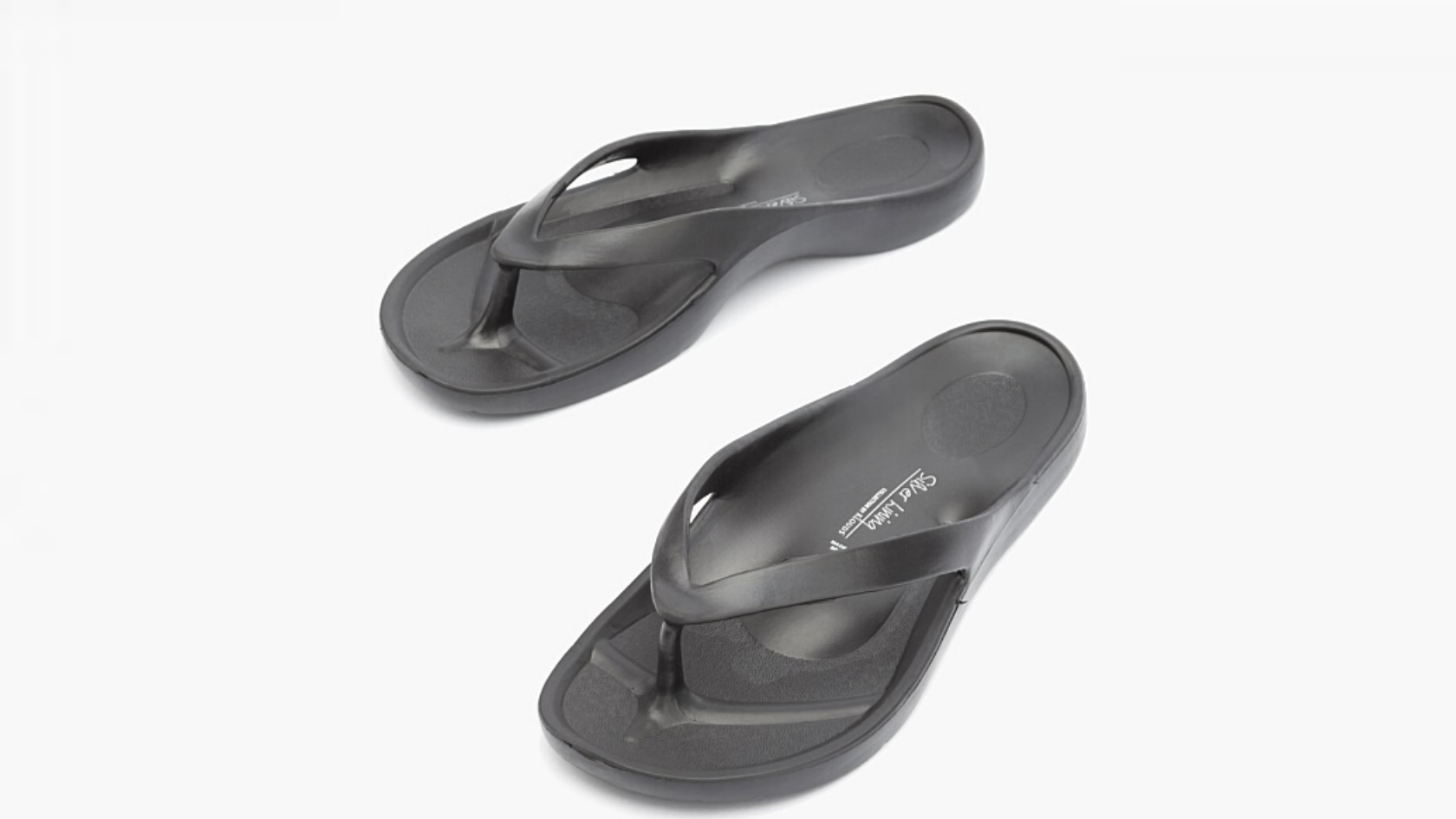 Two lightweight black thong sandals with arch support against a neutral background