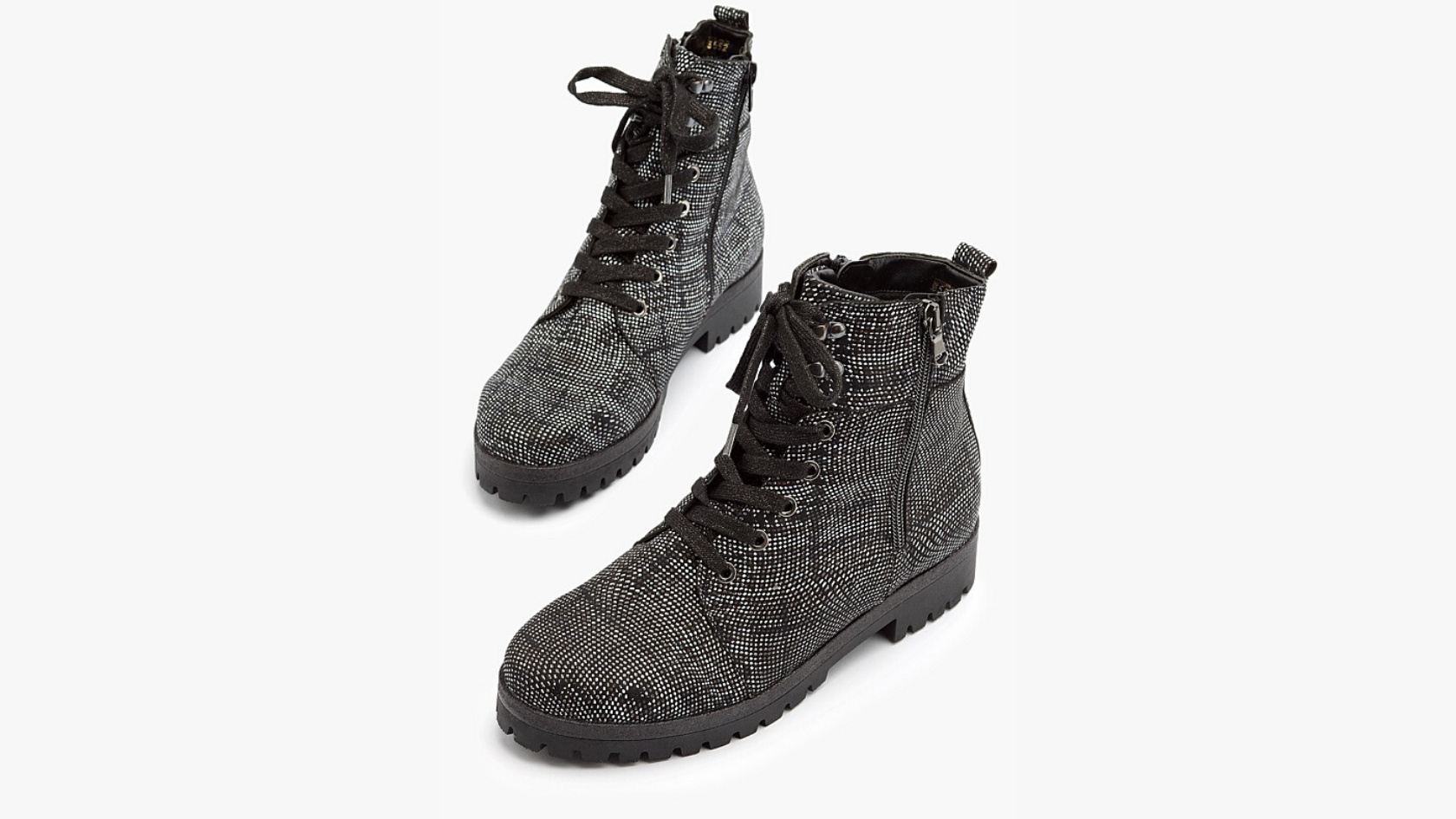 A pair of women’s Waldlaufer black and white waterproof lace up boots against a neutral background. 